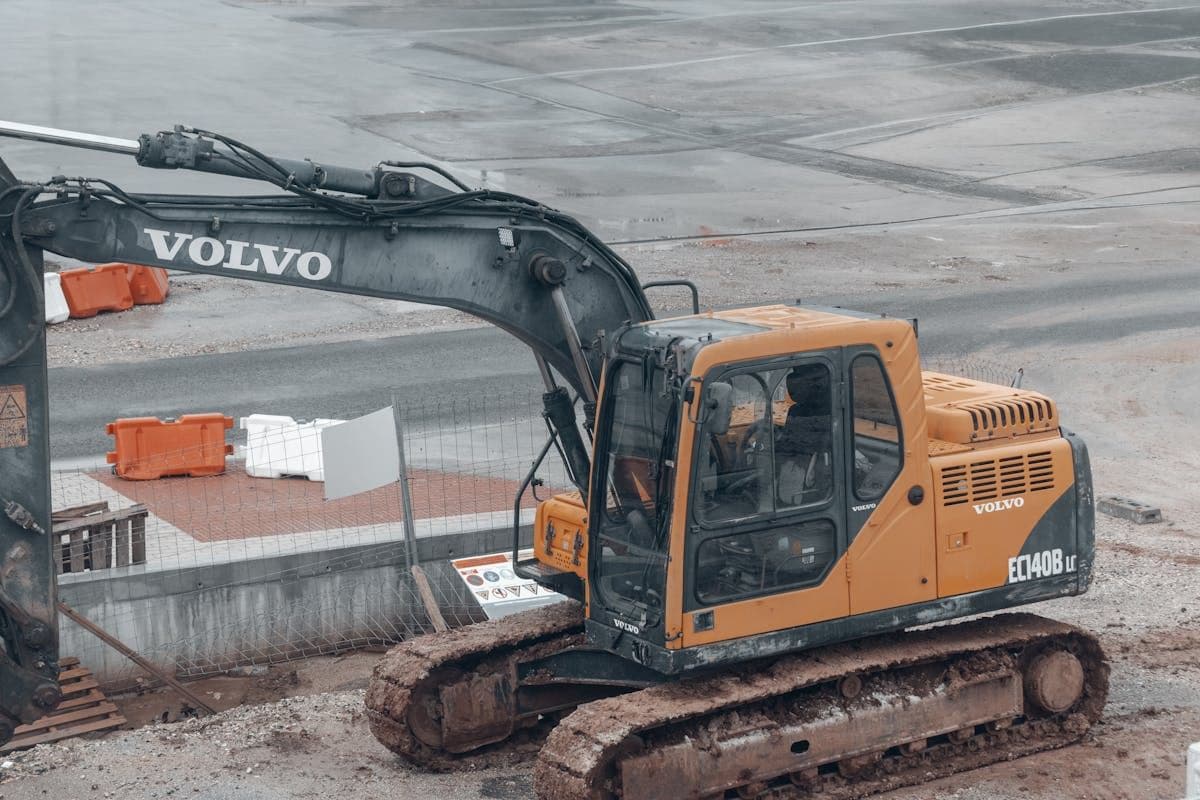 Earthworks machinery preparing building pad